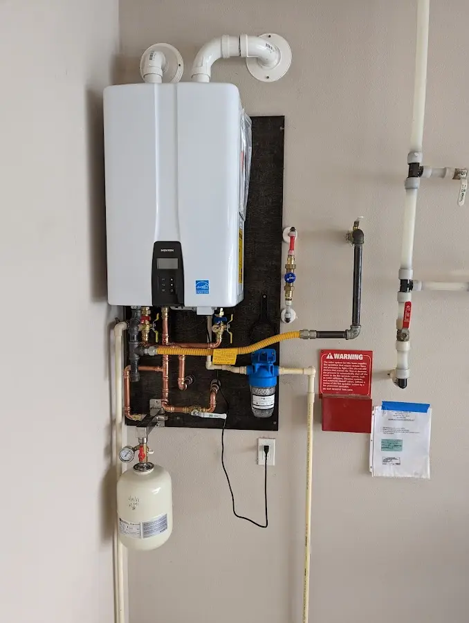 Professional plumber installing copper piping in a Wheeling home