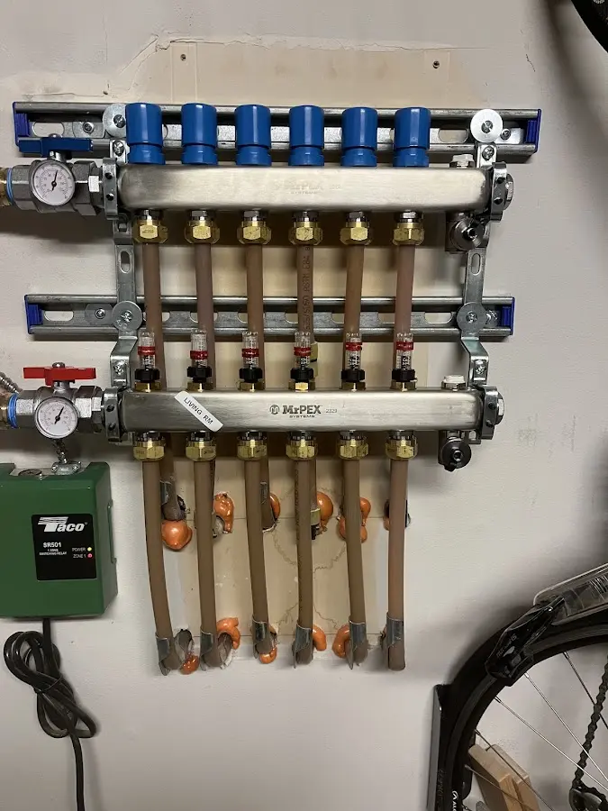 Plumber performing Water Heater Repair at a residential property in Wheeling